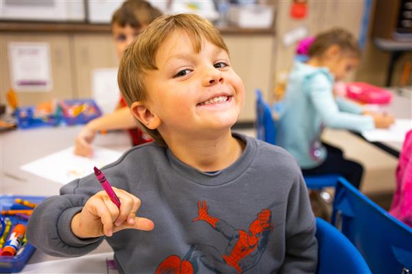 Students inside their classrooms learning. 